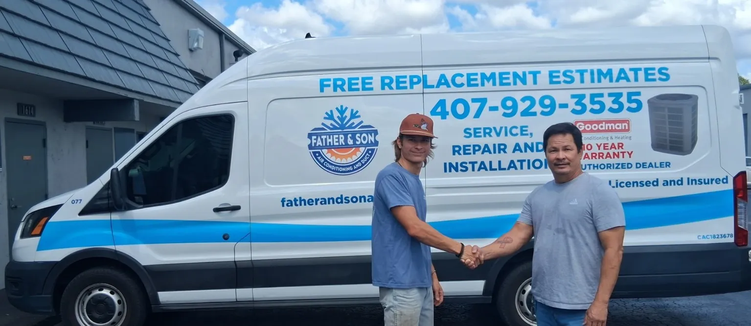 Tony and Jon Luke Ventresca shaking hands in front of the Father and Son Air Conditioning and Duct service van